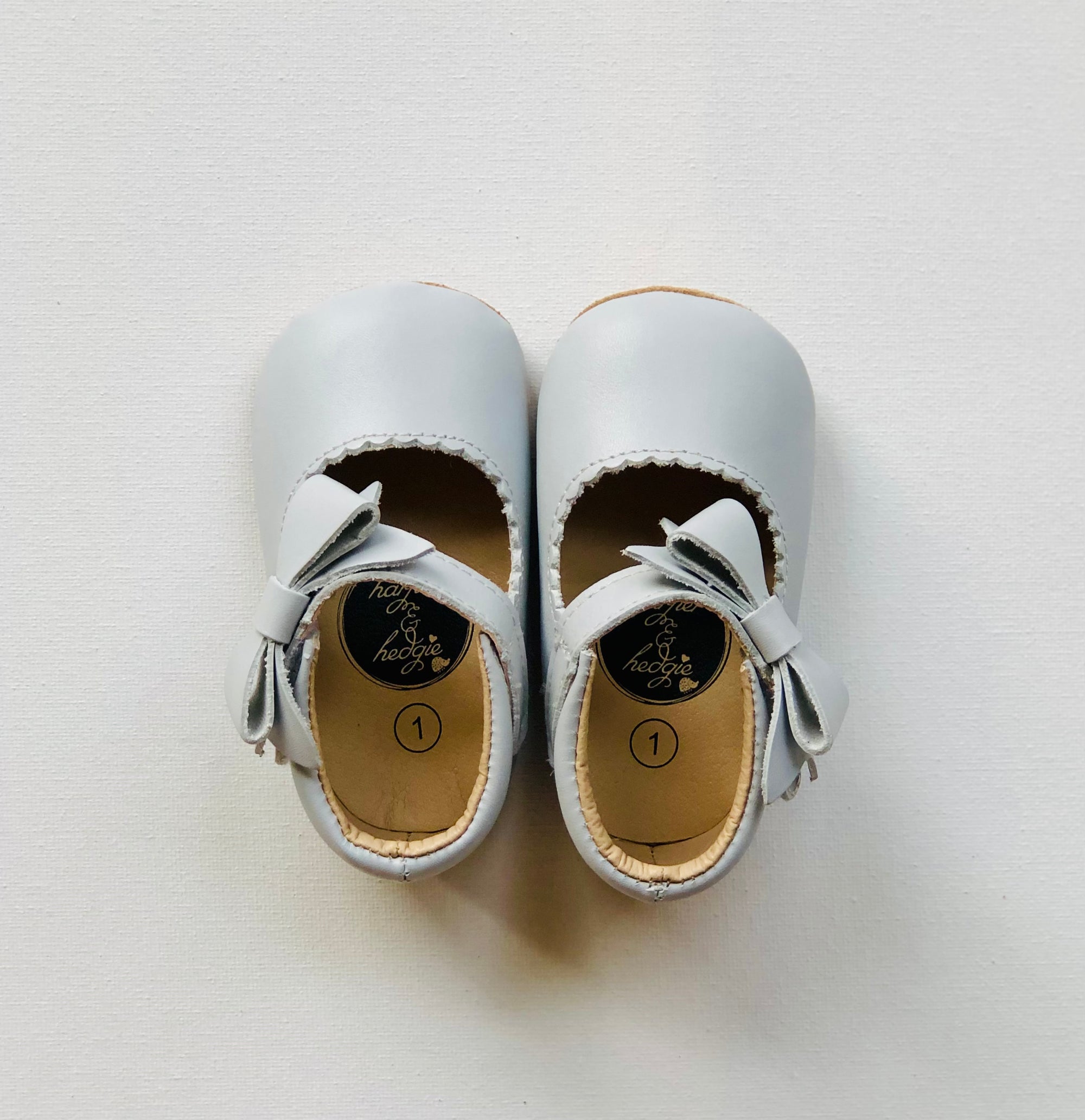 Grey Mary Janes for infants and toddlers featuring soft genuine leather and rubber soles from Harper & Hedgie.