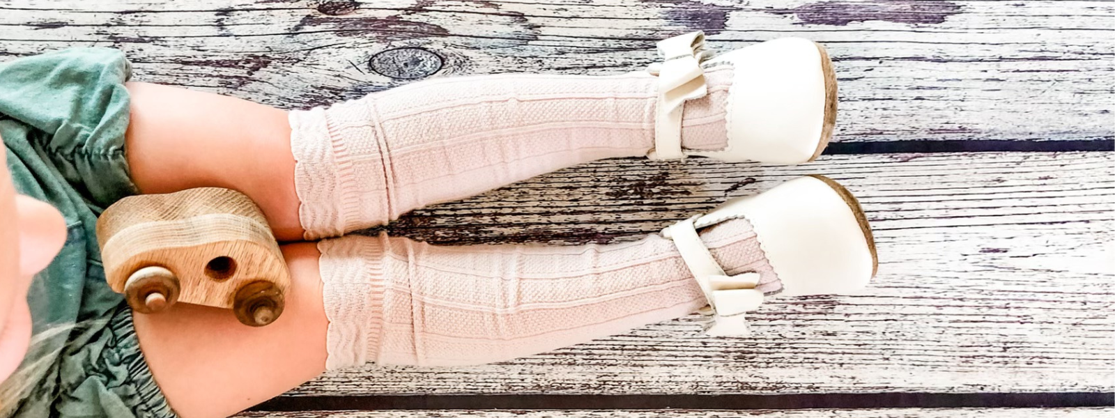 Kid wearing knee high socks and leather mary jane shoes