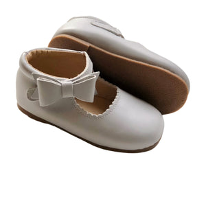 light gray Mary Jane baby shoes with scalloped edges and bows