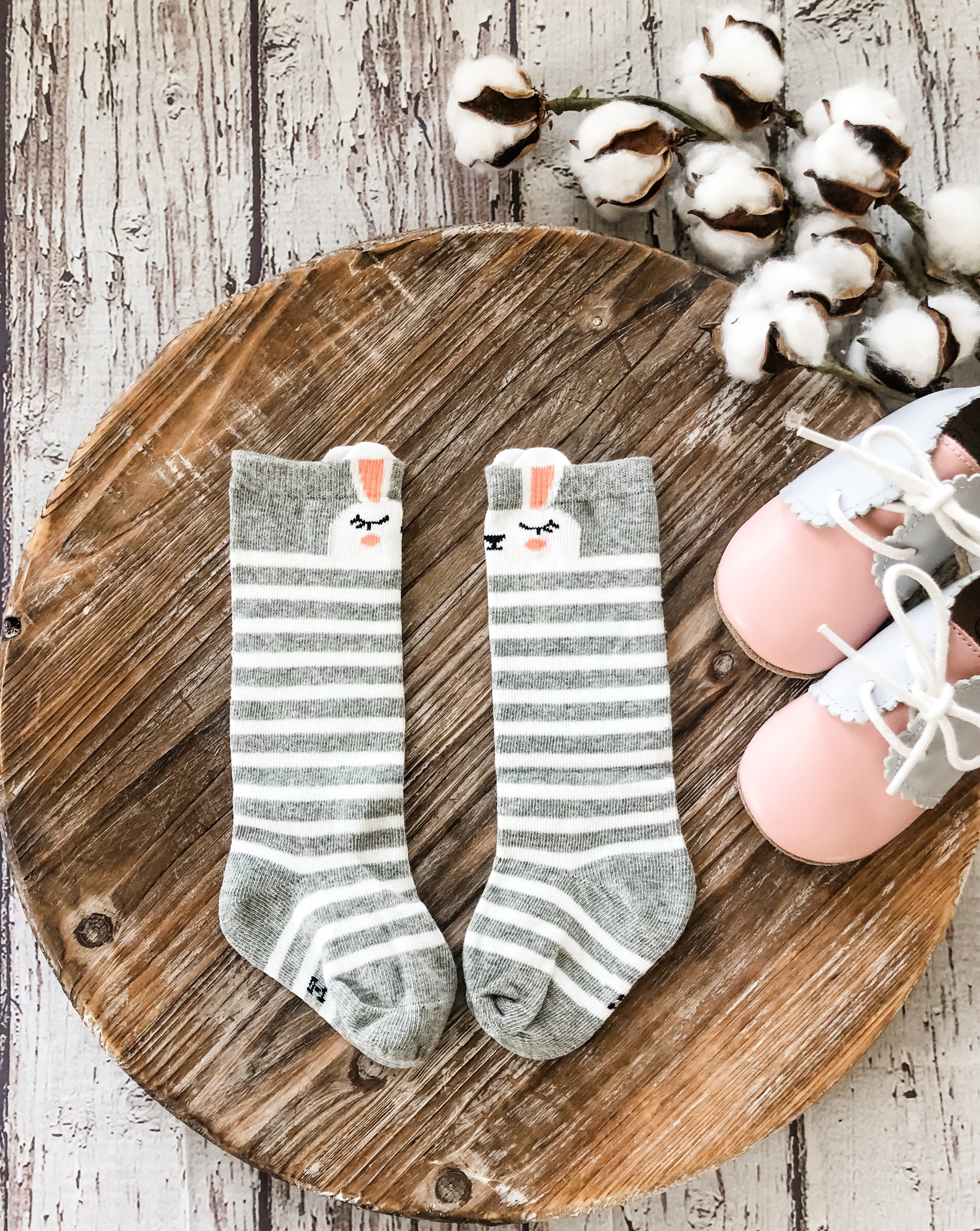 Adorable Tilly Rabbit Knee High Socks with heather grey and white stripes, featuring a sweet bunny face. The perfect cozy touch for little outfits! 