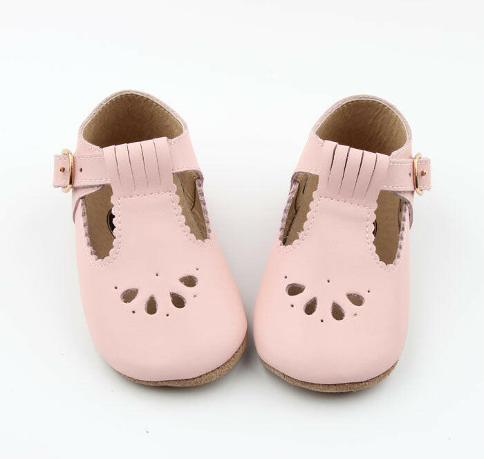 Pink T-Bar leather baby shoes – soft, stylish, and perfect for little feet.