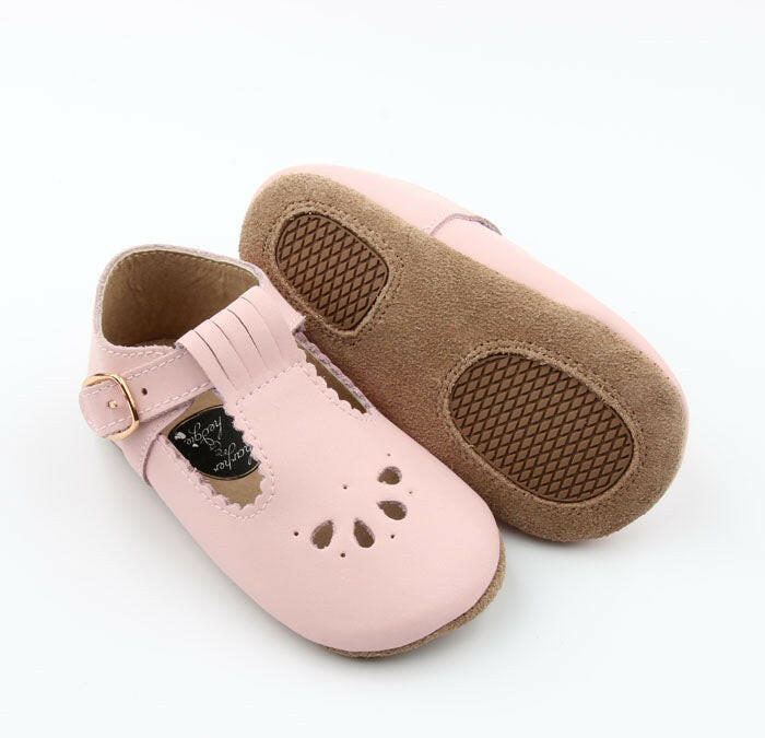 Close-up of Pink T-Bar baby shoes with premium leather and secure buckle.