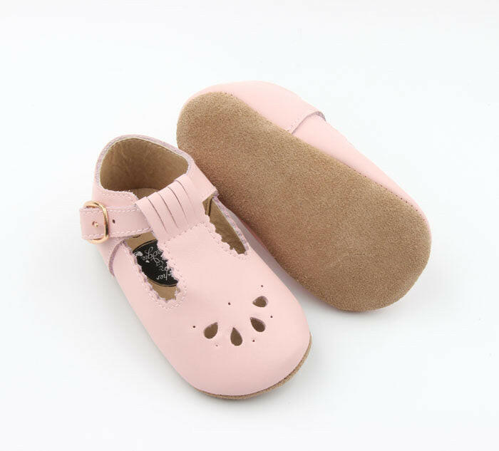 Close-up of Pink T-Bar baby shoes with premium leather and secure buckle.